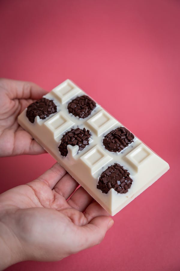 Hands Holding White Chocolate